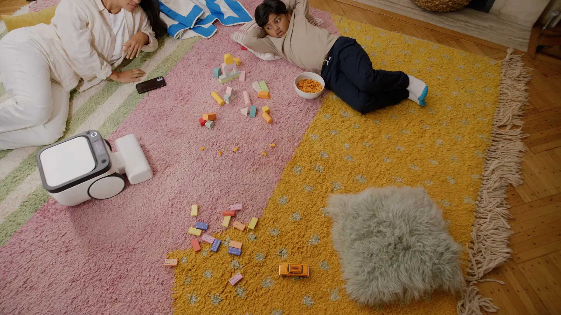 Kids playing in their room while Matic cleans the rug