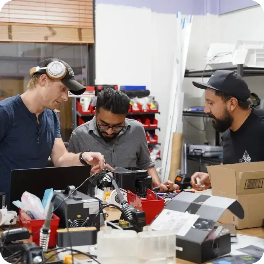 The Matic team building robots in the workshop