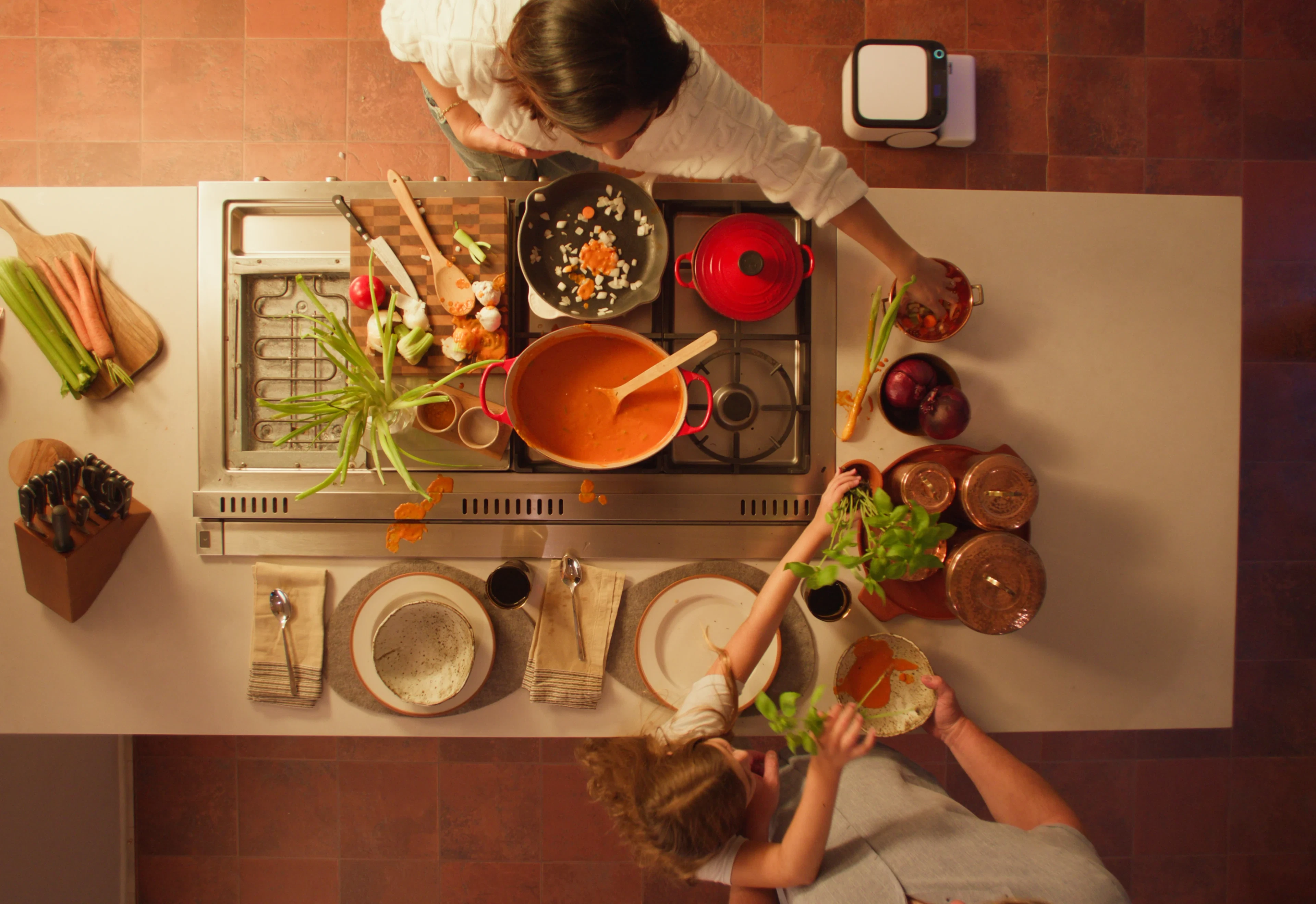Dinner cooking on the stove, seen from above, with Matic close by