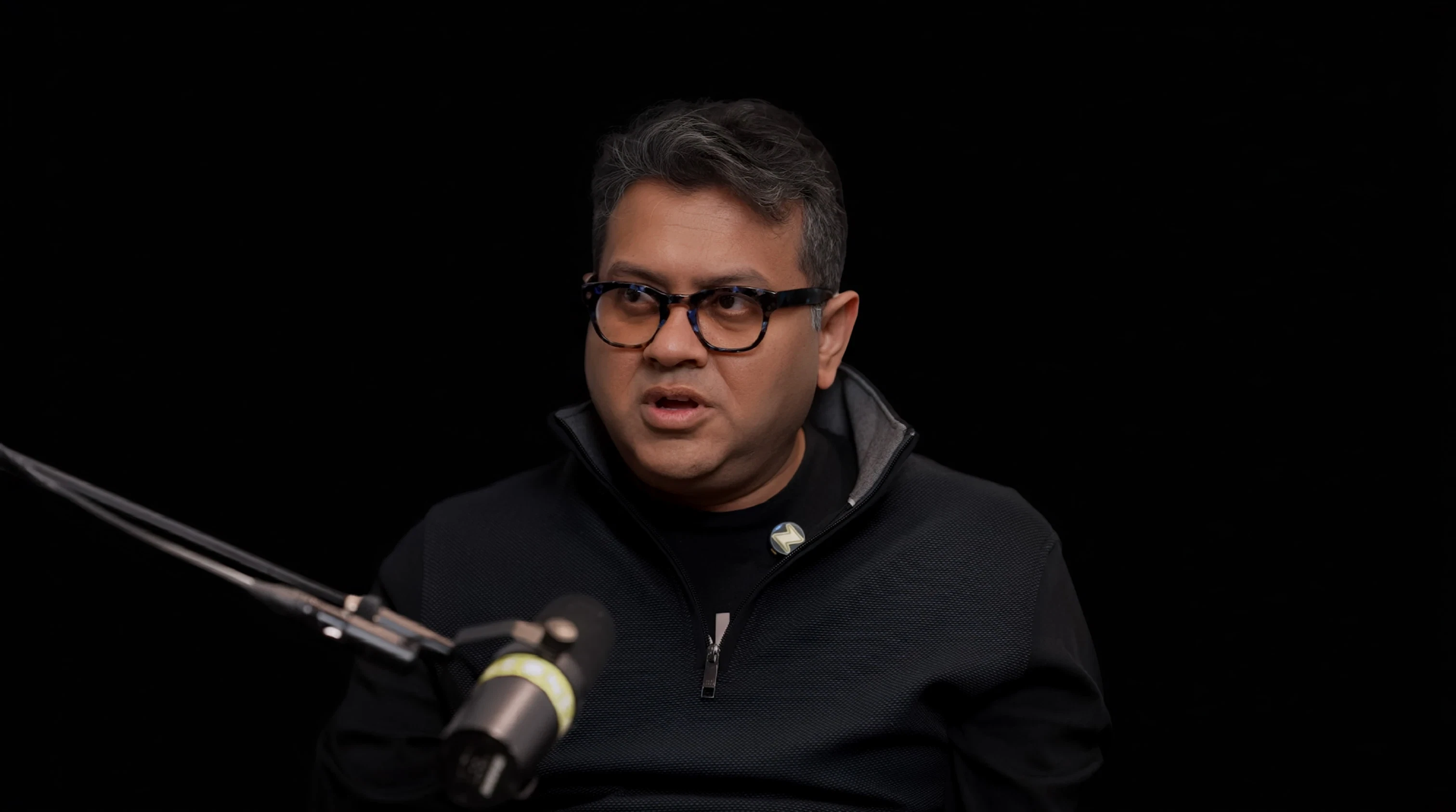 Mehul Nariyawala speaking into a microphone