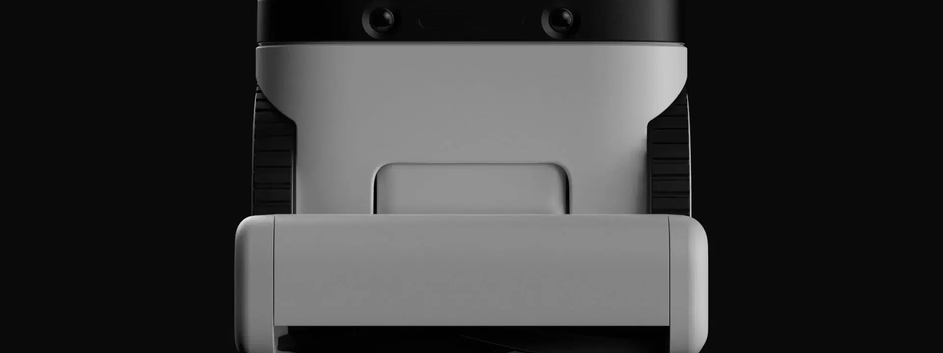 Matic seen head on, its two cameras facing the room and its wheels turning